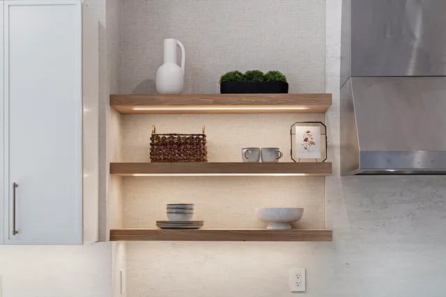a close view of white cabinets and a wooden floor