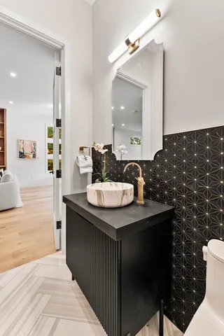 a bathroom with a sink and a mirror