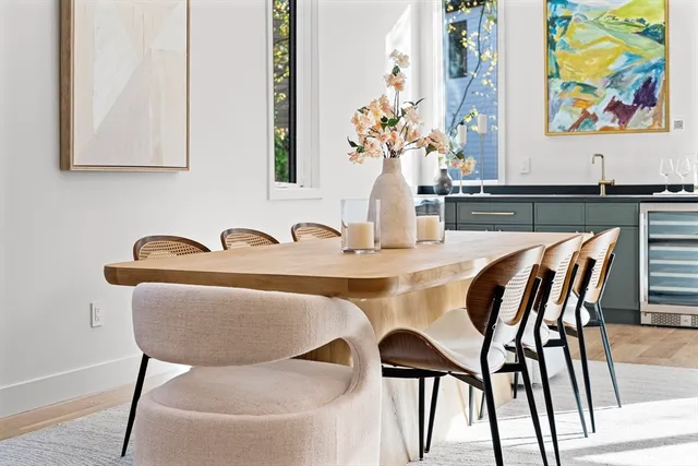 a dining room with furniture and wooden floor