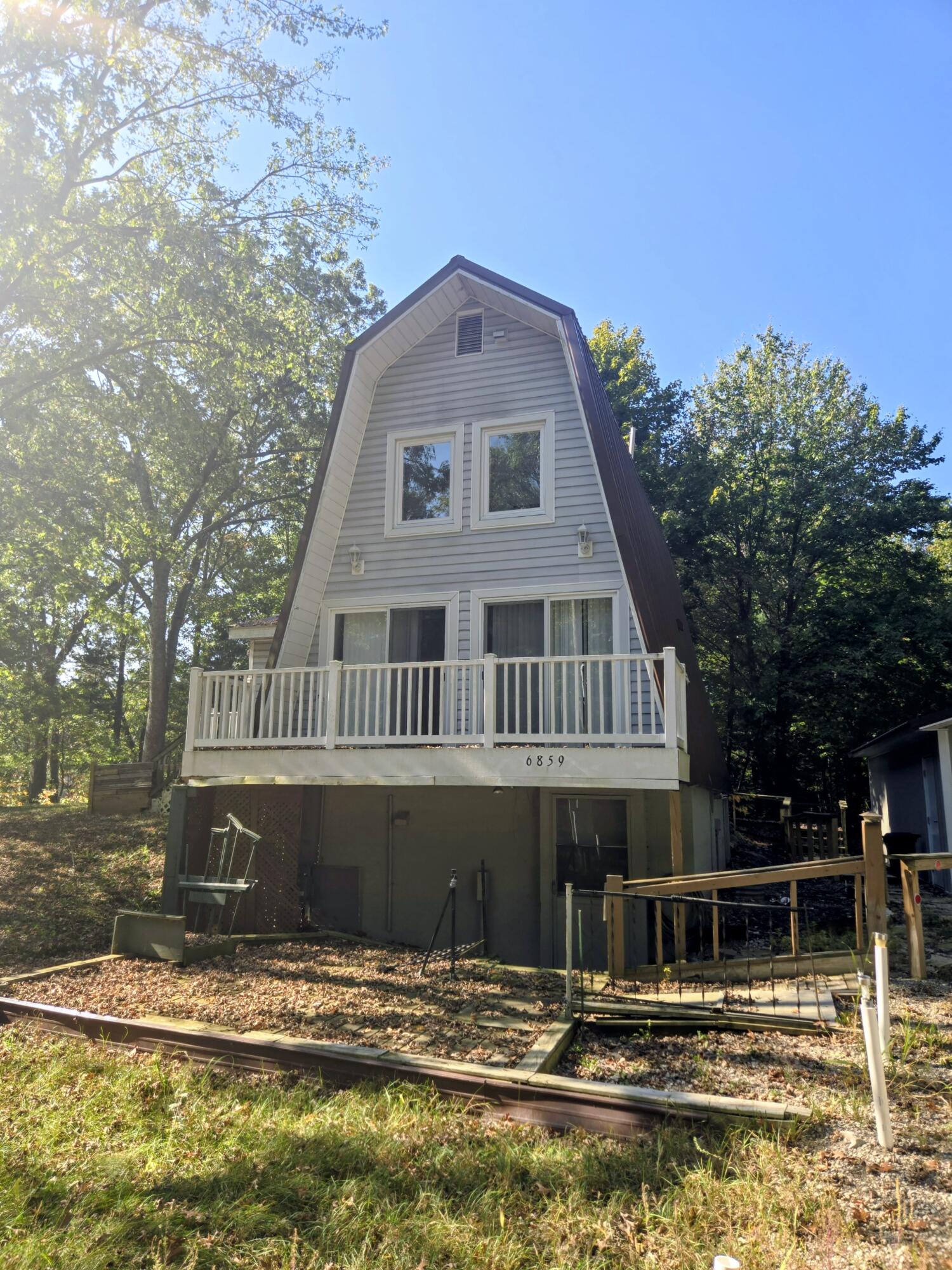 6859 Clover Road Twin Lake, MI 49457 - Photo 40 of 52 Summer view