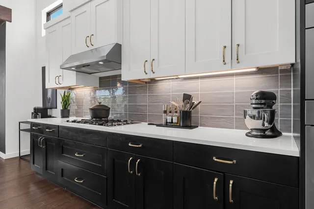 a kitchen with a sink and cabinets