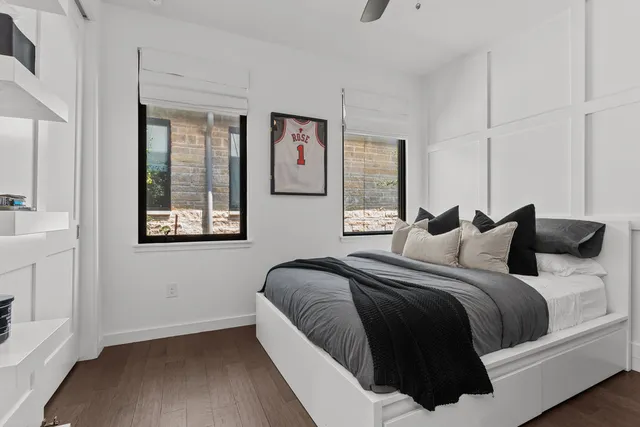 a bedroom with a bed and a window