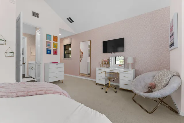 a bedroom with a workspace