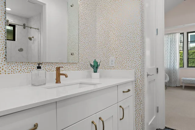 a bathroom with a sink and a mirror