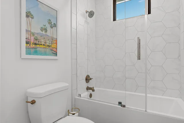 a bathroom with a bathtub and a toilet