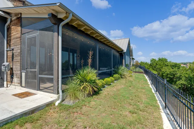 a couple of potted plants in front of door