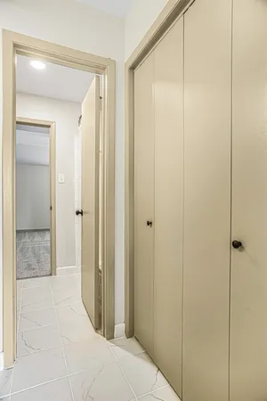 a bathroom with a shower and a glass door