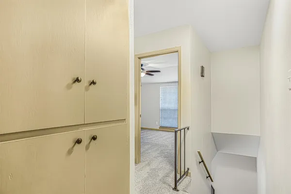 a bathroom with a shower and a glass door