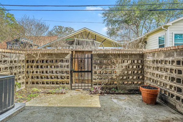 a view of a blue house with large windows