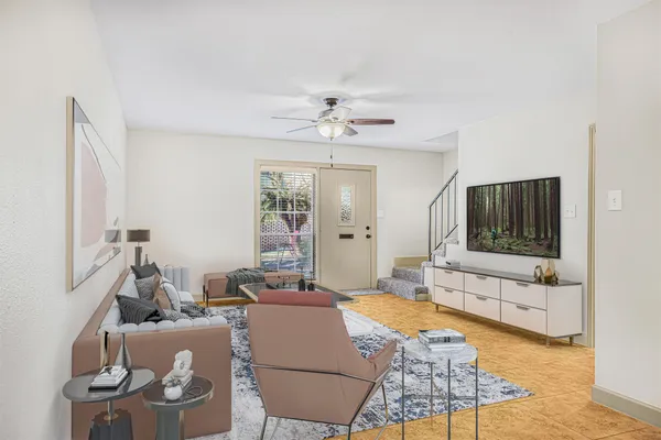 a living room with furniture and a flat screen tv