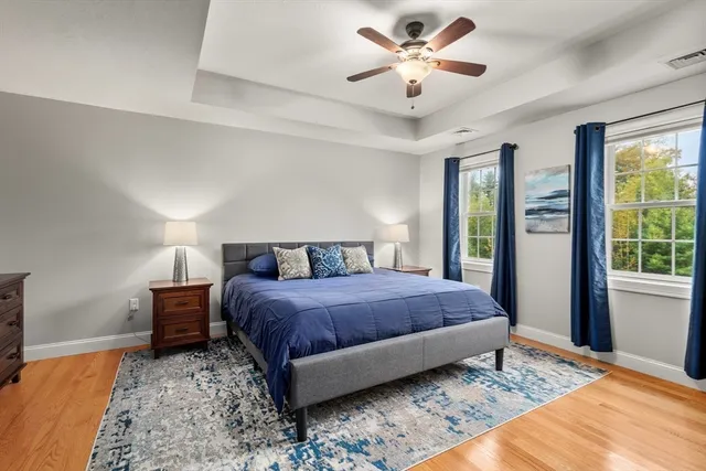 a bedroom with a large bed and a window