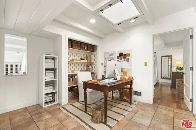 a view of a workspace with furniture