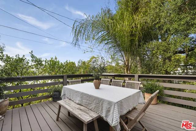 a view of a balcony with chairs