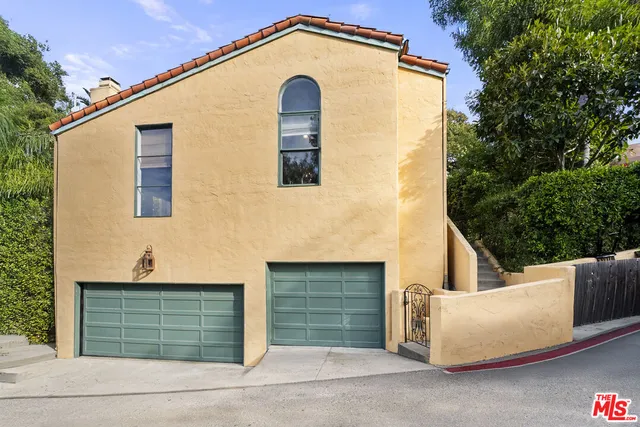 a front view of a house with garage