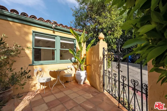 a view of a chairs and table in the balcony