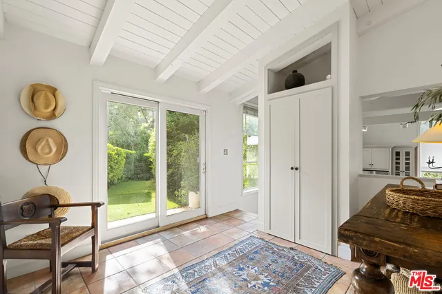 a view of a room with workspace and a window