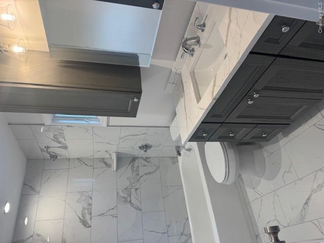 24 Moriches Road Lake Grove, NY 11755 - Photo 11 of 31 a bathroom with a granite countertop sink toilet and shower