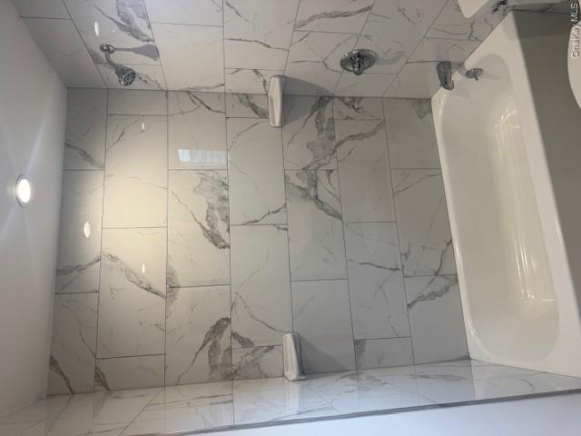 24 Moriches Road Lake Grove, NY 11755 - Photo 12 of 31 a bathroom with a bathtub