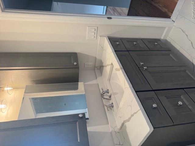 24 Moriches Road Lake Grove, NY 11755 - Photo 13 of 31 a bathroom with a sink and a mirror