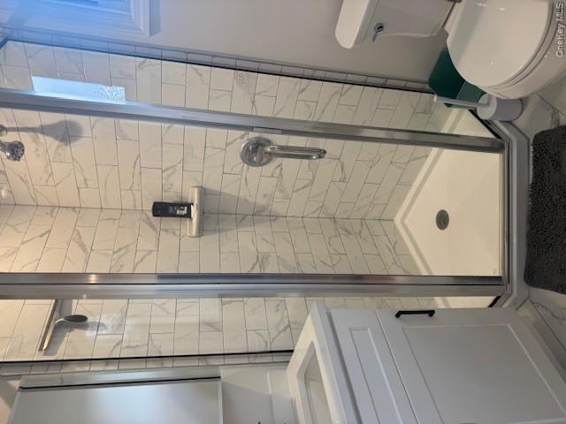 24 Moriches Road Lake Grove, NY 11755 - Photo 14 of 31 a bathroom with a shower and toilet