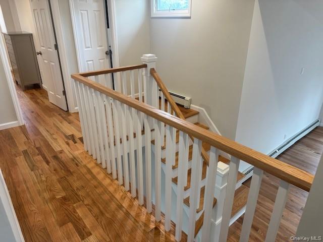 24 Moriches Road Lake Grove, NY 11755 - Photo 15 of 31 a view of entryway with wooden floor