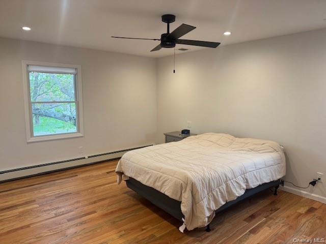 24 Moriches Road Lake Grove, NY 11755 - Photo 16 of 31 a bedroom with a bed and a window