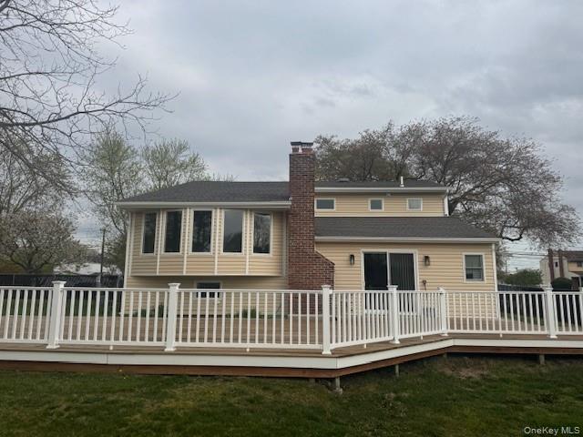 24 Moriches Road Lake Grove, NY 11755 - Photo 23 of 31 a front view of a house with a garden