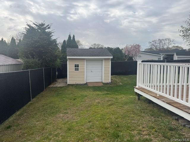 24 Moriches Road Lake Grove, NY 11755 - Photo 26 of 31 a view of a backyard with white fence