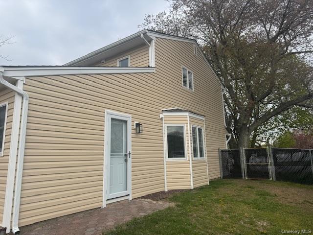 24 Moriches Road Lake Grove, NY 11755 - Photo 28 of 31 a view of a house with a yard