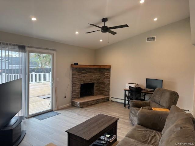 24 Moriches Road Lake Grove, NY 11755 - Photo 7 of 31 a living room with furniture and a fireplace