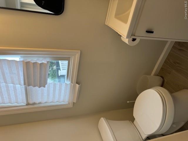 24 Moriches Road Lake Grove, NY 11755 - Photo 10 of 31 a white toilet sitting next to a bathroom sink