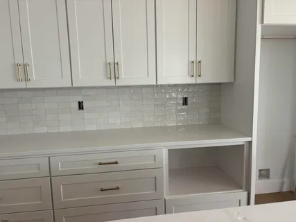 a view of cabinets and window