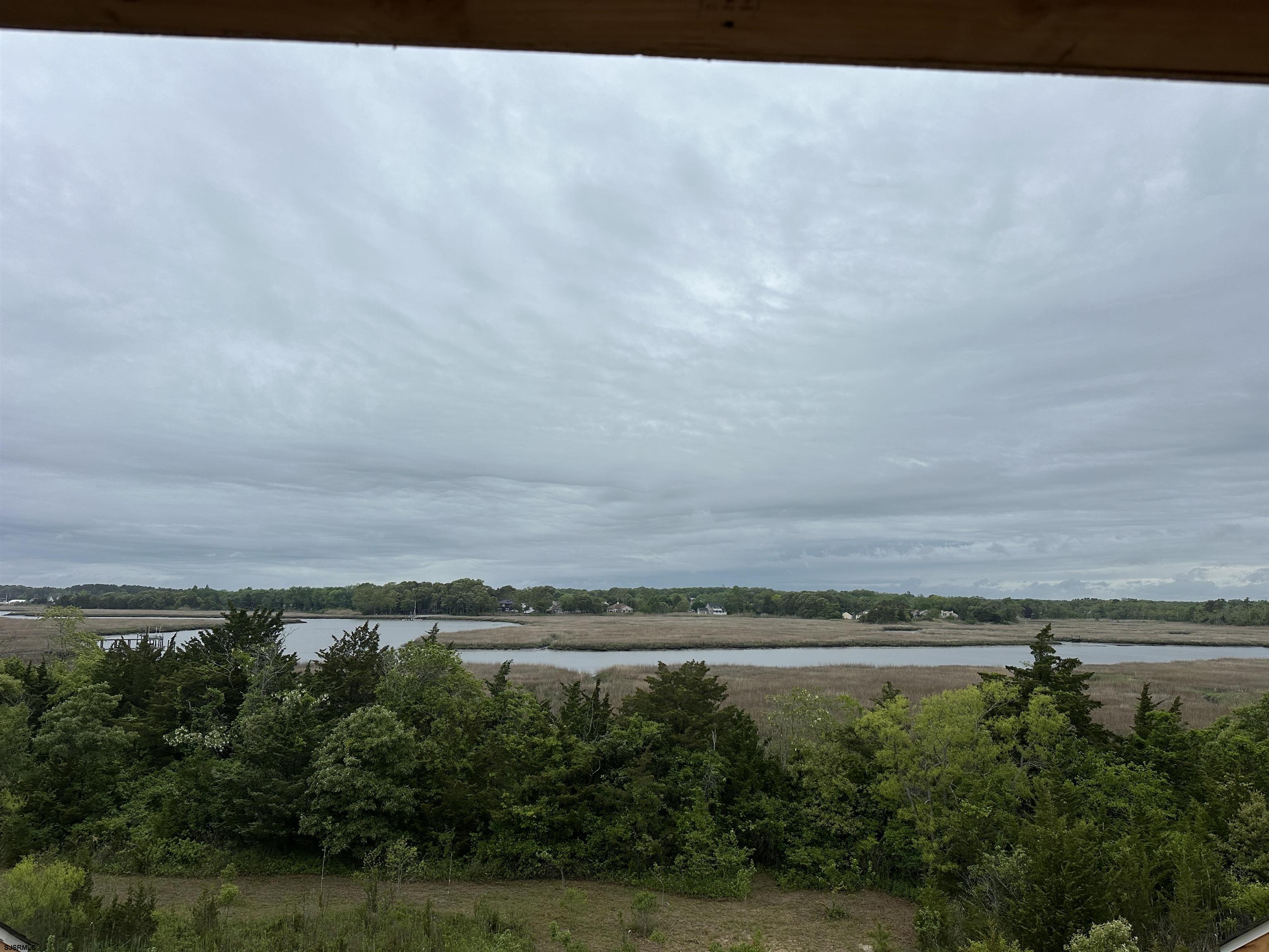 16 Creek Lane Linwood, NJ 08221 - Photo 18 of 26 a view of a river and mountains in the background
