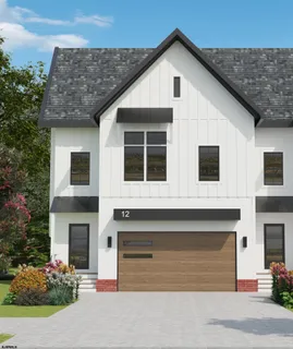 a front view of a house with garage