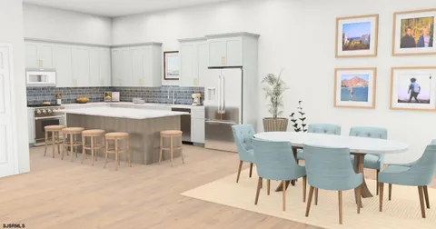 a kitchen with white cabinets and sink