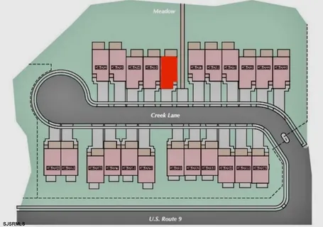 a front view of a house with a garden and yard