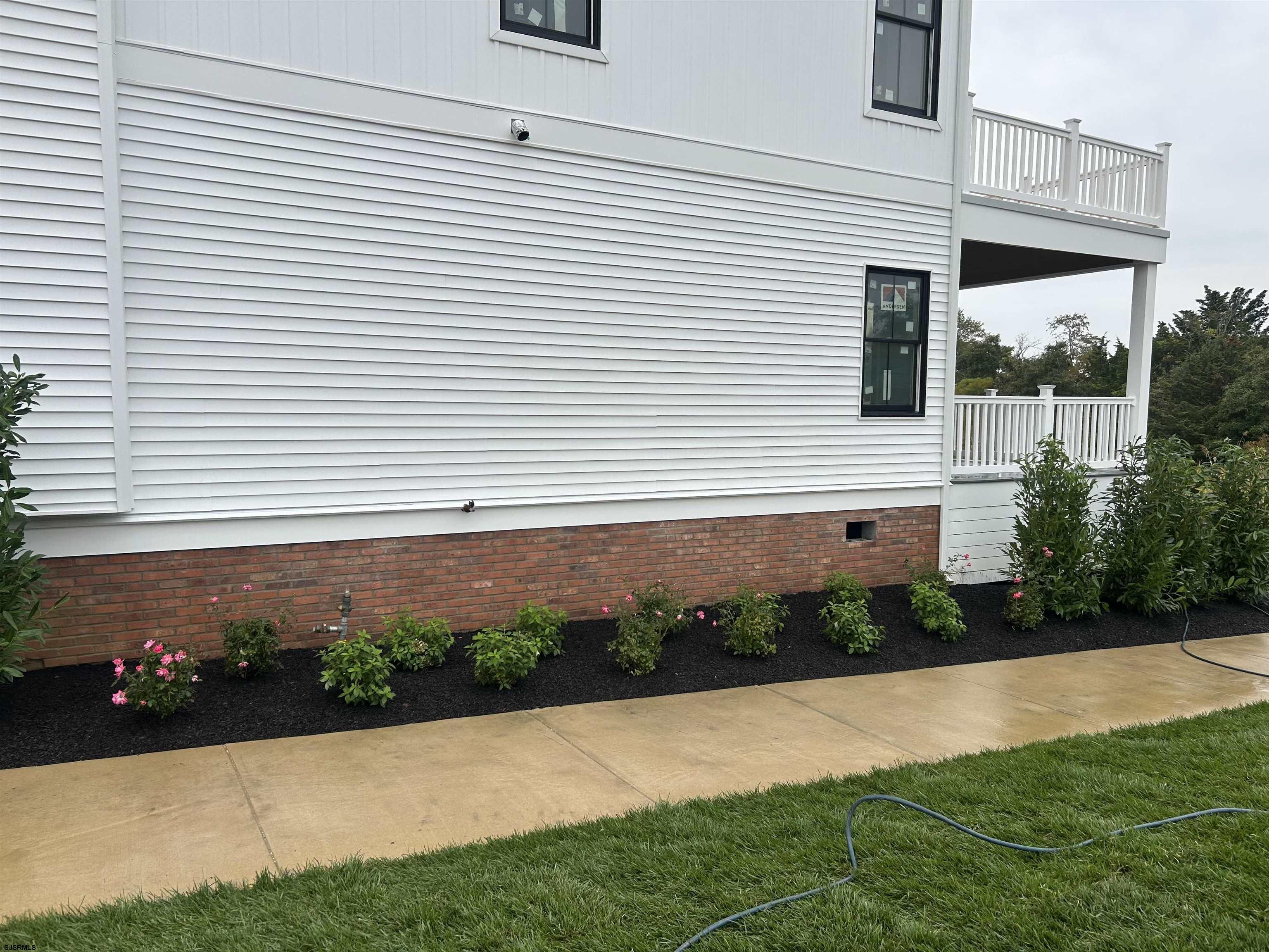 16 Creek Lane Linwood, NJ 08221 - Photo 6 of 26 a front view of a house with a yard and garage