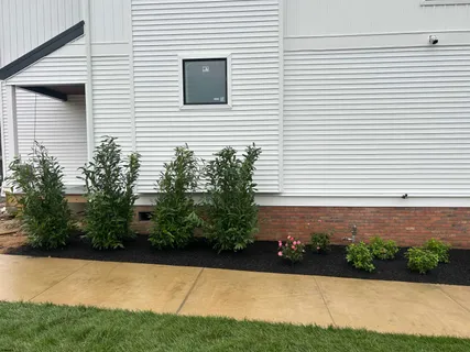 a front view of a house with a yard and a garage