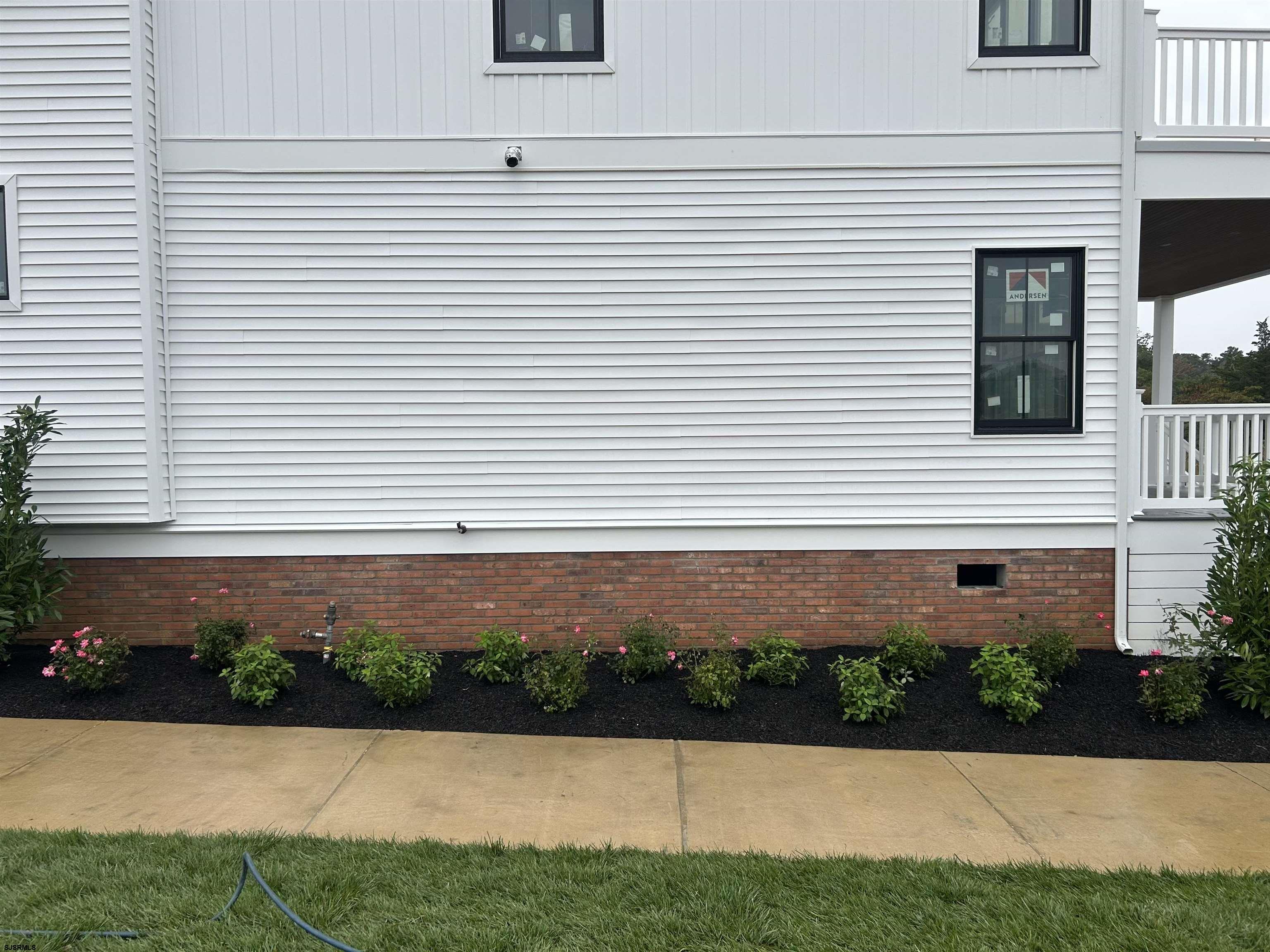 16 Creek Lane Linwood, NJ 08221 - Photo 9 of 26 a front view of a house with a yard and a garage