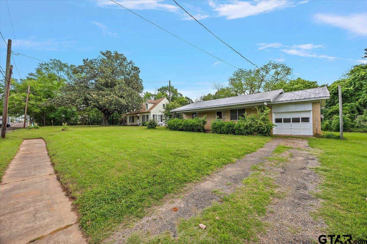 459 Main Street Rusk, TX 75785 - Photo 4 of 12 a view of a house with backyard and a tree
