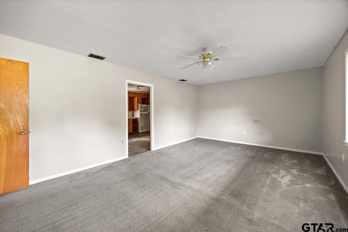 459 Main Street Rusk, TX 75785 - Photo 5 of 12 a view of an empty room with a window