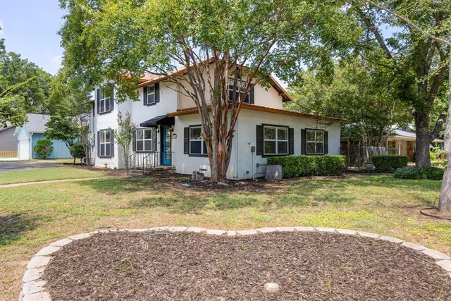 a view of a house with swimming pool and porch with furniture