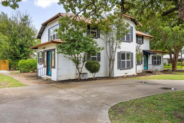a view of a house with a street