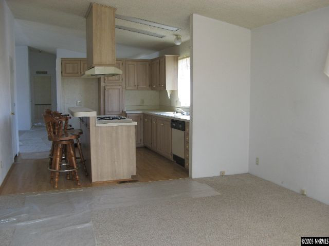 750 Reservoir Road Lovelock, NV 89419 - Photo 2 of 9 an empty room with a kitchen