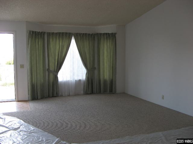750 Reservoir Road Lovelock, NV 89419 - Photo 3 of 9 an empty room with a window