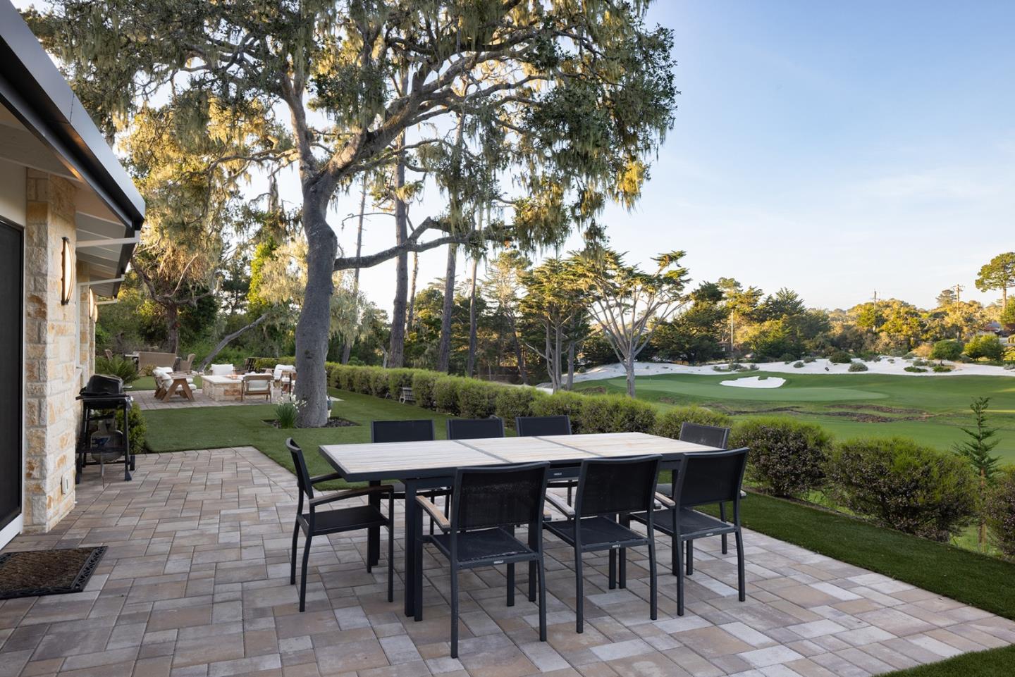 2931 Sloat Road Pebble Beach, CA 93953 - Photo 18 of 34 a view of a patio with a table chairs and a table