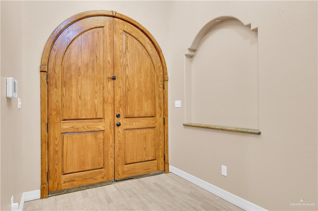 2005 Stuart Road Weslaco, TX 78599 - Photo 22 of 30 a view of an entryway with front door