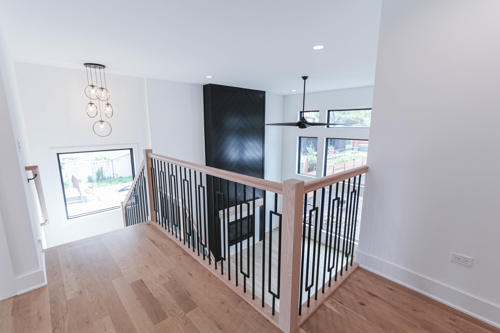 26205 Stewart Ridge Drive Plainfield, IL 60585 - Photo 17 of 27 a view of hallway with wooden floor and windows