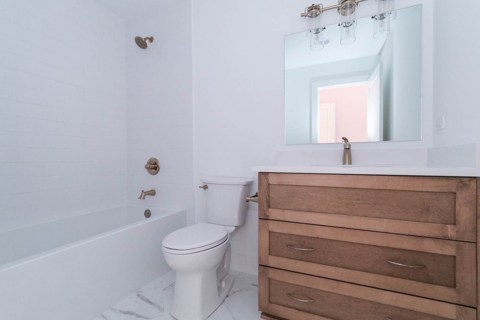 26205 Stewart Ridge Drive Plainfield, IL 60585 - Photo 27 of 27 a bathroom with a sink a toilet and shower