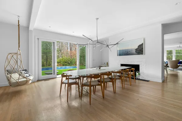 a dining room with furniture window wooden floor